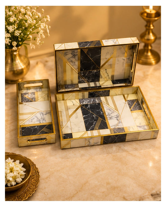 Marble-look tray set styled on a console with flowers