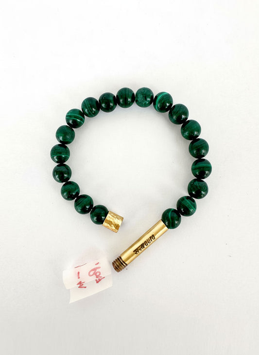Malachite stone bracelet worn on wrist
