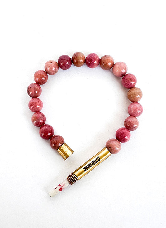 Rhodochrosite stone bracelet worn on wrist