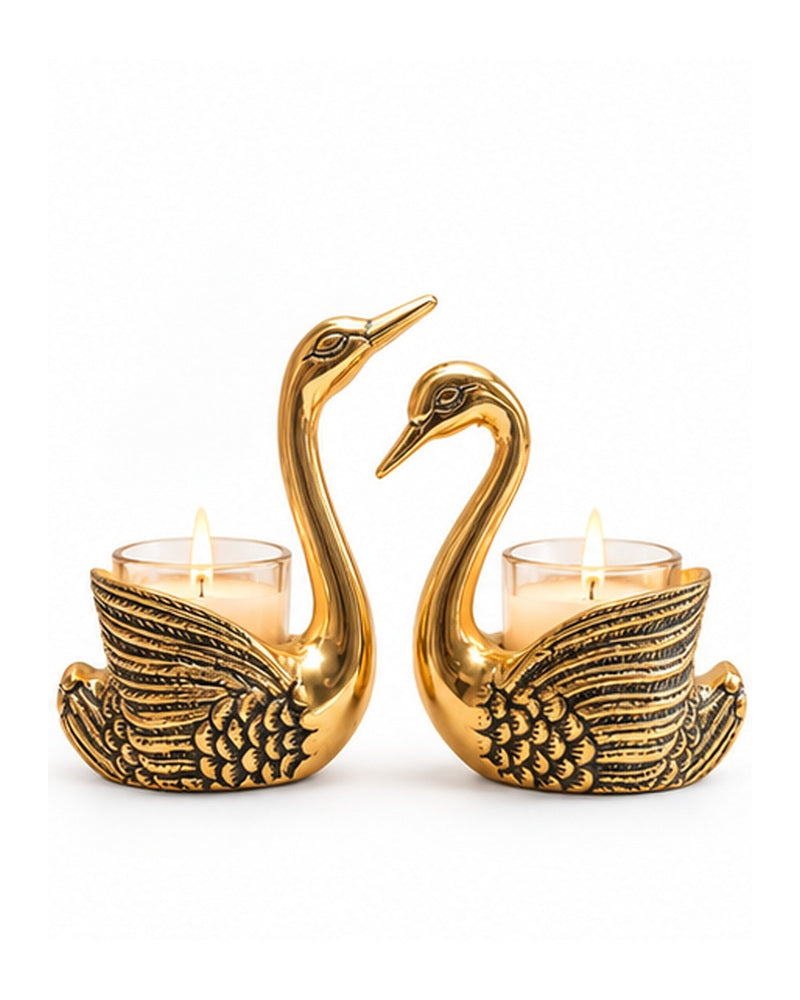 Pair of golden swan tealight candle holders, front view