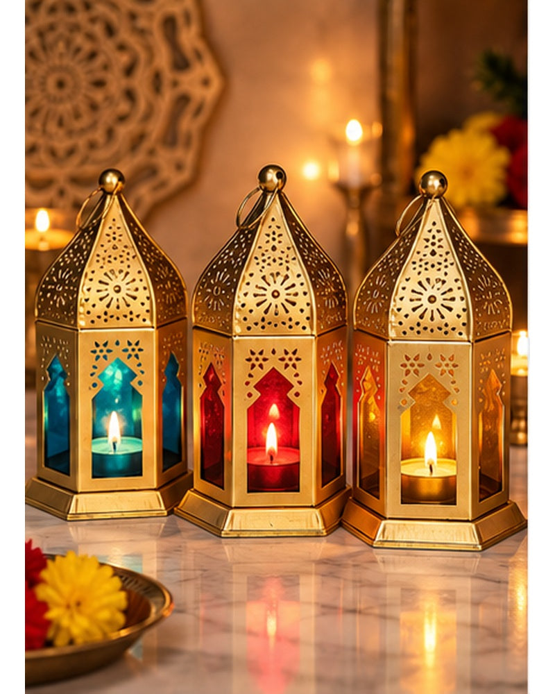 Gold jaali hanging lanterns set of 3, lit, in a festive setting