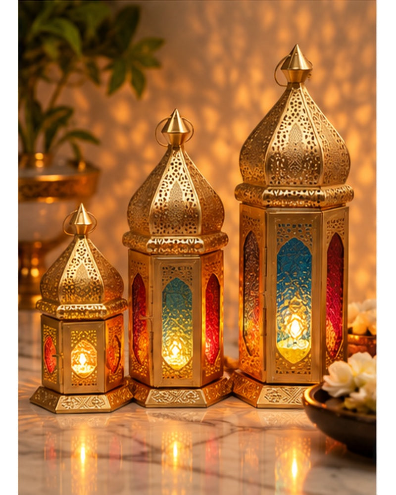 Gold jaali lanterns with coloured glass set of 3, lit, in a festive setting