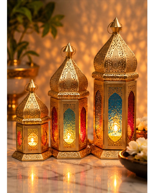 Gold jaali lanterns with coloured glass set of 3, lit, in a festive setting