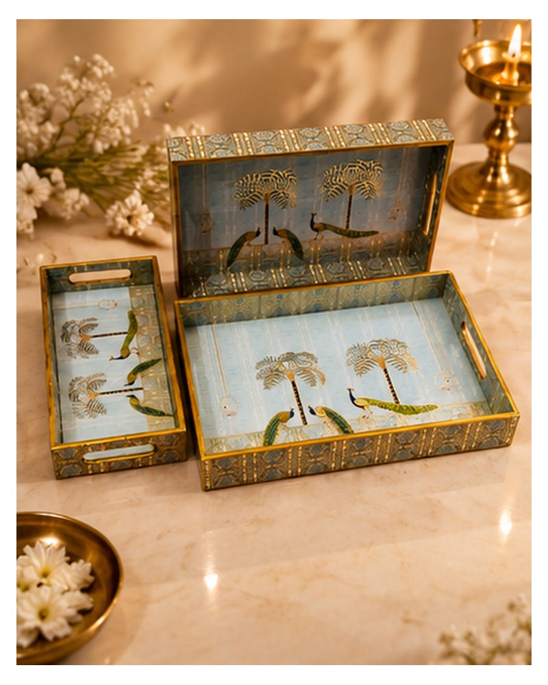 Pichwai palm tray set styled on a marble table with flowers