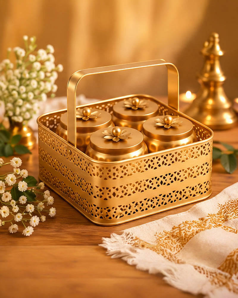 Gold jaali basket with jars styled on a festive table with flowers