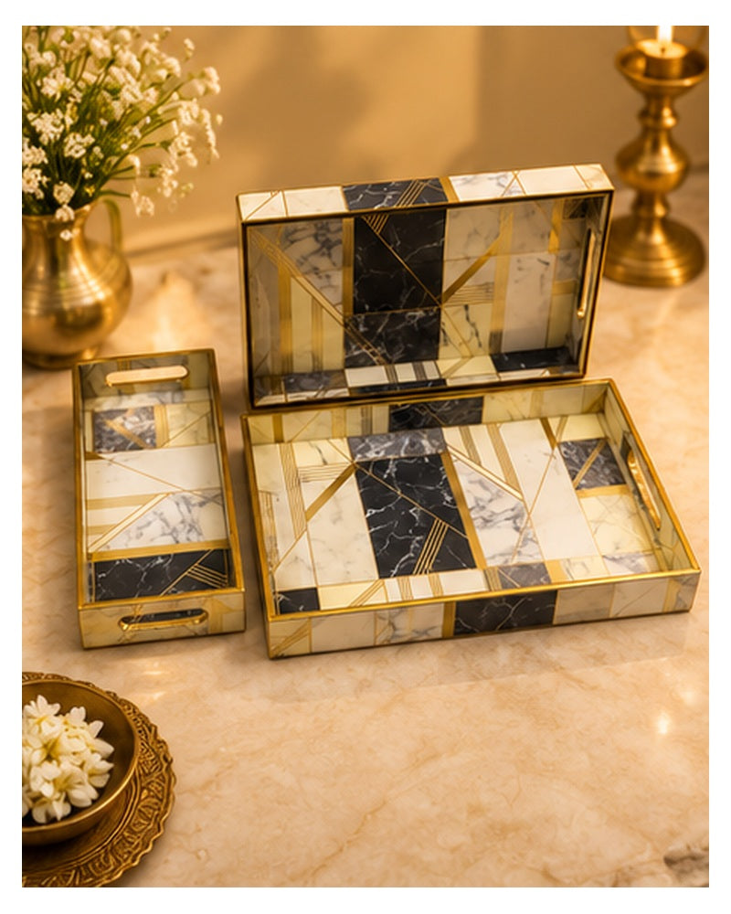 Marble-look tray set styled on a console with flowers