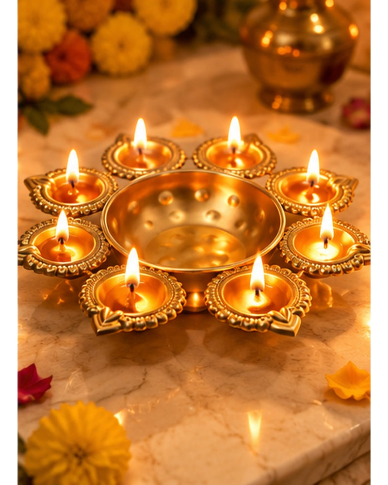 Brass lotus multi-diya platter, lit, in a warm festive setting