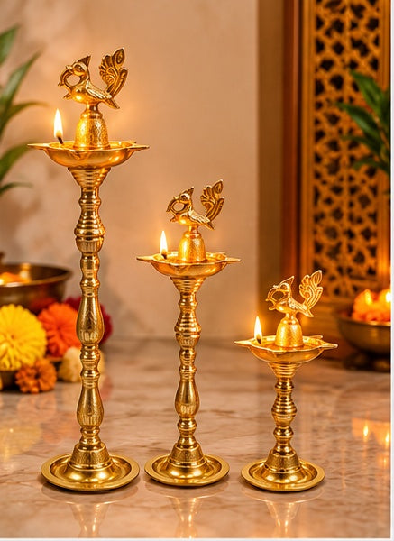 Brass peacock samai diya stands set of 3, styled in a festive setting