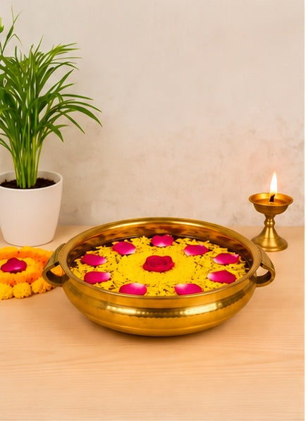 Gold urli with handles, styled in a festive setting