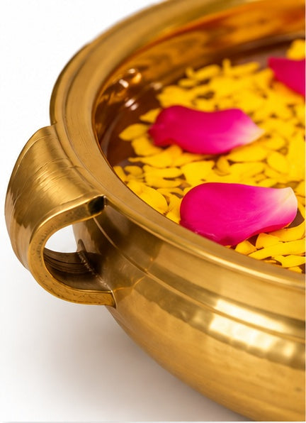 Gold urli with handles, close-up detail