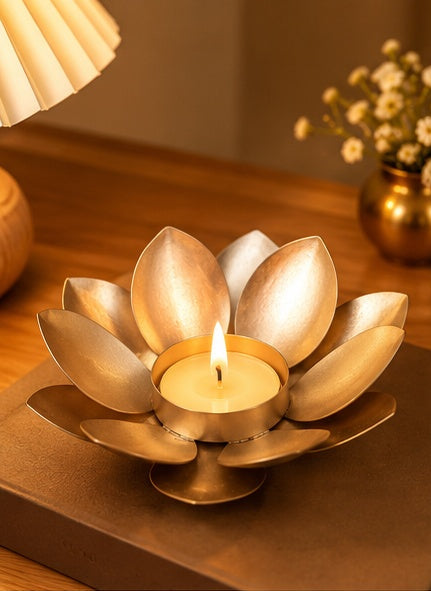Gold lotus tealight holder, styled in a festive setting
