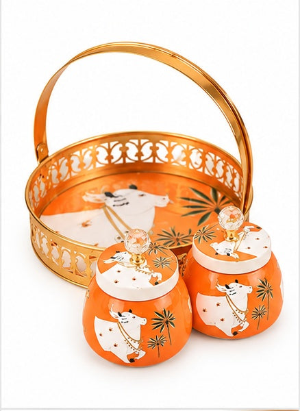 Orange Pichwai cow basket tray with 2 jars, front view