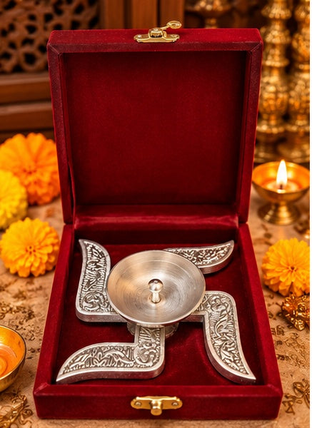 Silver swastik diya in red velvet box