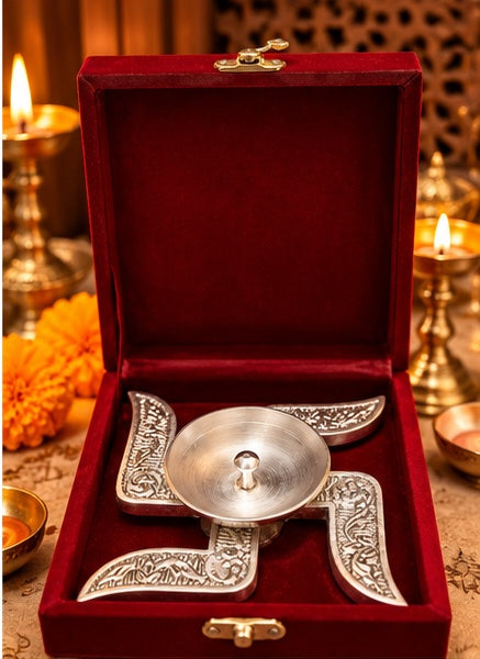 Silver swastik diya in red velvet box