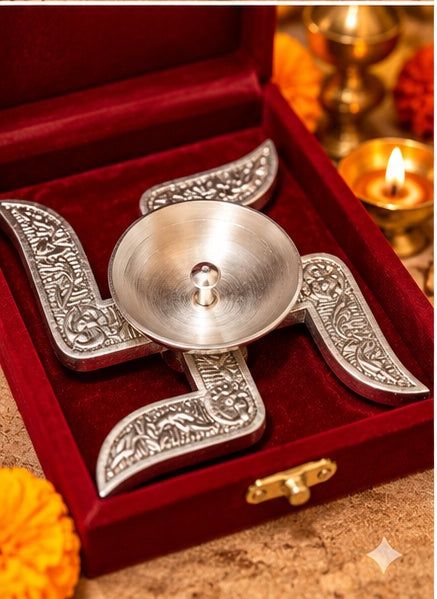 Silver swastik diya in red velvet box