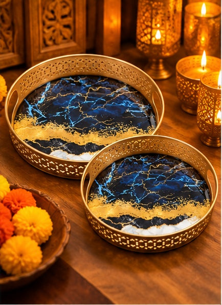 Blue and gold marble look round trays set of 2, styled in a festive setting